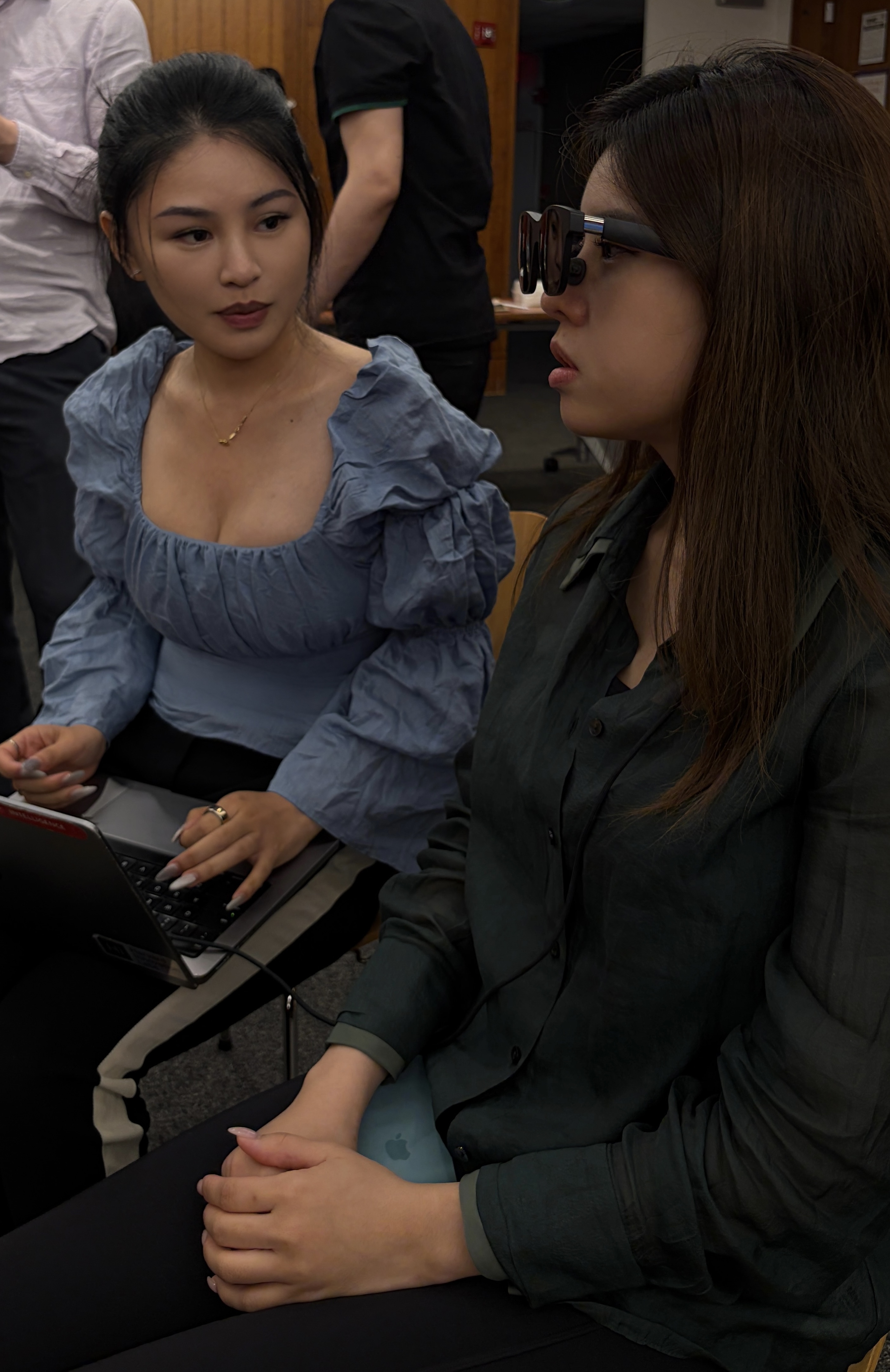 Two testers discussing Dreama during a product session.